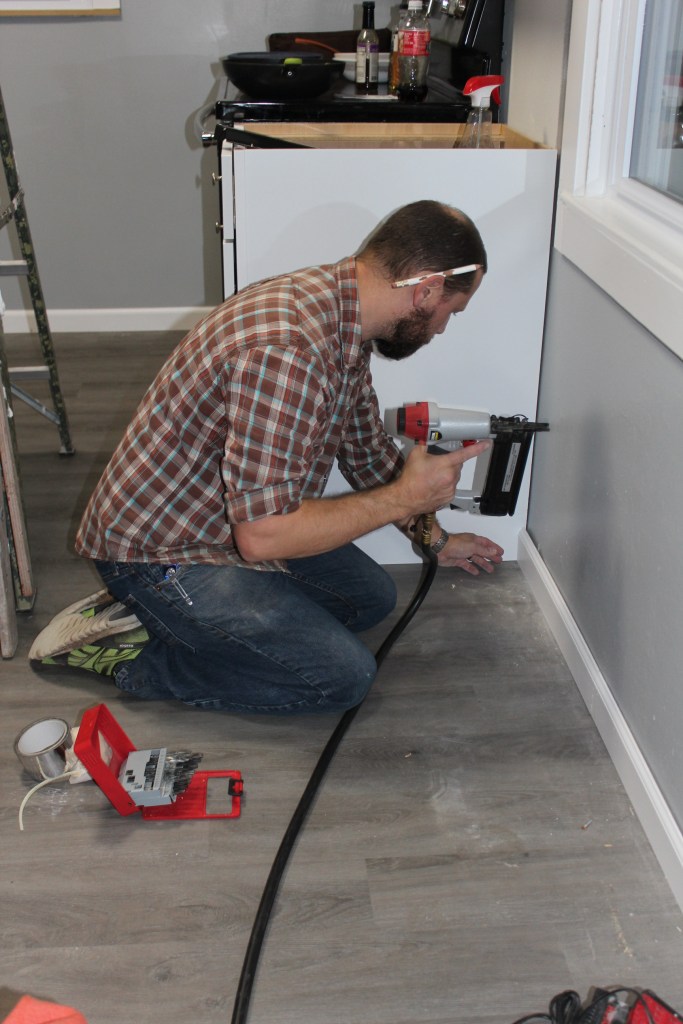 Danny nailing down the baseboards